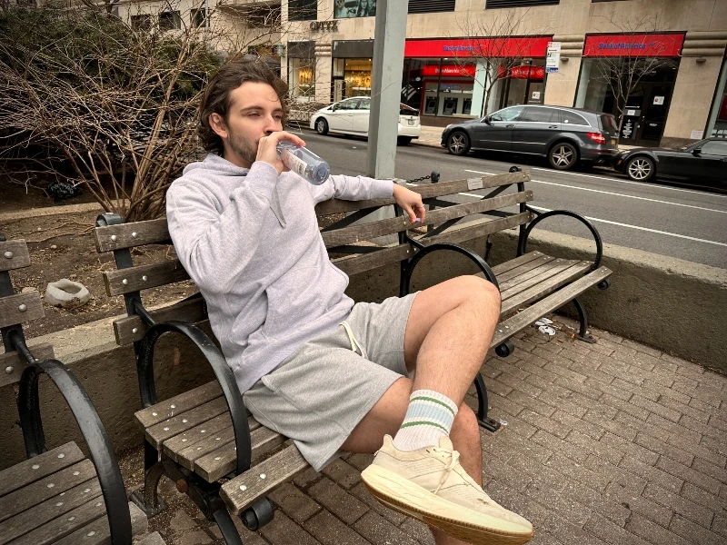 Reigning Champ Midweight Terry Pullover Hoodie Sitting on Bench