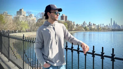 Model Wearing Cozy Earth with Manhattan Skyline in Background