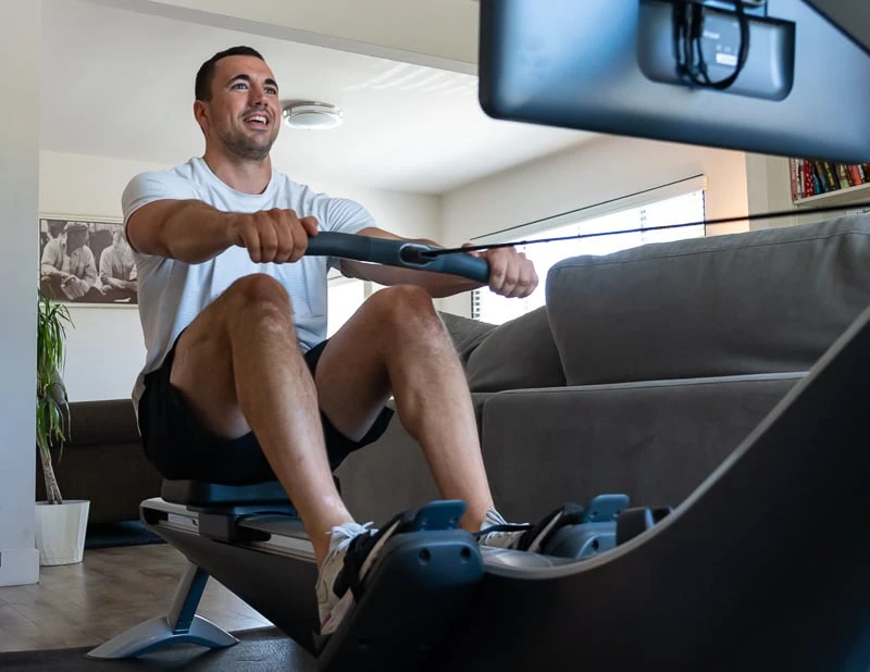 Model smiliing on Hydrow Pro Rower